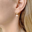 gold filled circular shaped stud earrings are adorned with pink opal roundel drops.