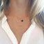 Layered birthstone and circle necklace with sapphire pendant on delicate gold chains
