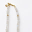 Gold-filled lobster clasp and 1-inch extender chain with moonstone drop on a rainbow moonstone beaded necklace