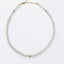 Rainbow moonstone beaded necklace with faceted rondelle beads, 14k gold-filled accent beads and lobster clasp, laid flat on white