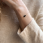 Black onyx bracelet styled with a cozy knit sweater