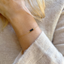 Black onyx three-bead bracelet worn on the wrist