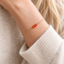 Dainty carnelian bracelet worn on the wrist
