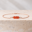Dainty carnelian bracelet in 14k rose gold-filled on travertine