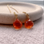 Carnelian threader earrings in 14k gold-filled on a cream dish