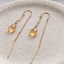 Citrine paperclip threader earrings in 14k gold filled on a speckled ceramic dish