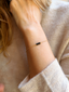 Delicate gold bracelet with black onyx beads and spring ring clasp