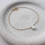 Opal teardrop charm on a delicate gold filled chain bracelet