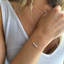 Opal beaded bracelet layered with a dainty opal necklace