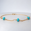 Turquoise station bracelet in 14k gold-filled with three faceted turquoise rondelles hand wire-wrapped on a dainty cable chain