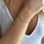Close-up of opal beaded bracelet on the wrist