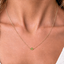 Minimal August birthstone peridot necklace sitting at the collarbone