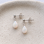 Sterling silver opal teardrop stud earrings with butterfly backs