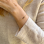 Delicate smoky quartz bracelet worn as an everyday layering piece