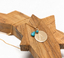 Personalized turquoise initial necklace in gold filled draped on a carved wooden star, handmade in NYC