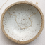 Cubic zirconia station necklace in a speckled stoneware bowl