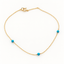 Gold filled chain with three genuine turquoise beads and spring ring clasp on a white background