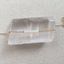 Gold opal bar bracelet on selenite