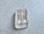 White opal gold drop earrings on crystal styling photo