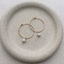 Opal hoop earrings in 14k gold-filled in a ceramic dish