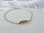 Three faceted smoky quartz beads on a 14k gold-filled bracelet chain