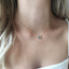 Dainty labradorite necklace worn at the collarbone
