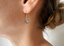 Labradorite drop earring on a French earwire worn on the ear
