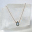 Faceted labradorite teardrop pendant on frosted stone