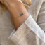 London blue topaz three-rondelle bracelet in 14k gold-filled modeled on the wrist with natural knitwear