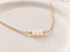 Close-up of Ethiopian opal fire on a handmade gold opal bead necklace