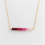 Ombré ruby necklace in 14k gold filled with faceted ruby rondelles shading from deep red to pale blush on a delicate cable chain