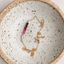 Ombré ruby necklace in gold filled with spring ring clasp in a speckled stoneware dish