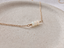 Close-up of Ethiopian opal fire on a handmade gold opal bead necklace