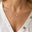 Dainty opal bead necklace in gold filled worn at the collarbone