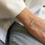 Dainty opal bead bracelet on the wrist