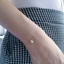 Opal teardrop bracelet styled with houndstooth