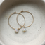 Thin gold hoops with faceted Ethiopian opal charms