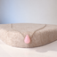 Sterling silver pink opal teardrop necklace on a felt stand