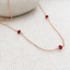 Garnet 3 bead station necklace in rose gold-filled with three faceted garnet beads