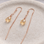 Citrine paperclip threader earrings in 14k rose gold filled on a ceramic dish