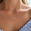 Rose gold filled opal beaded bar necklace worn on the neckline