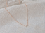 Rose gold-filled dainty freshwater pearl necklace on textured linen