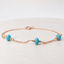Turquoise station bracelet in 14k rose gold-filled with three faceted turquoise rondelles on a fine cable chain