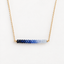 Ombré sapphire necklace in 14k gold filled with faceted sapphire rondelles shading from deep navy to pale ice blue on a delicate cable chain