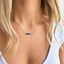Ombré sapphire necklace in gold filled worn with a white tank top