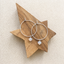 Sterling silver opal hoop earrings on a wooden star