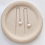 Dainty pearl threader earrings in sterling silver with a wire-wrapped freshwater pearl on a cable chain, in a speckled ceramic dish