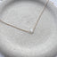 Dainty 14k gold filled moonstone necklace on ceramic dish