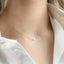 Dainty 14k gold filled moonstone necklace worn close to collarbone