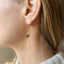 Dainty smoky quartz threader earring worn on the ear